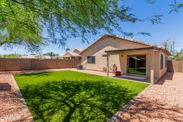 14919 W Hearn Cir, Surprise, AZ 85379 - back of property featuring stucco siding, cooling unit, a patio, and a tiled roof