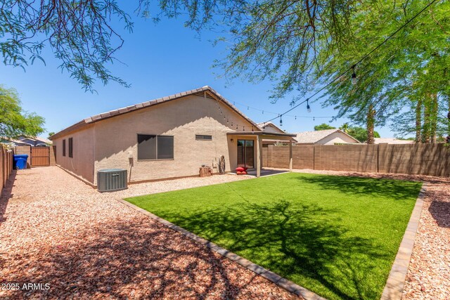 14919 W Hearn Cir, Surprise, AZ 85379 - back of property featuring central AC, stucco siding, and a gate