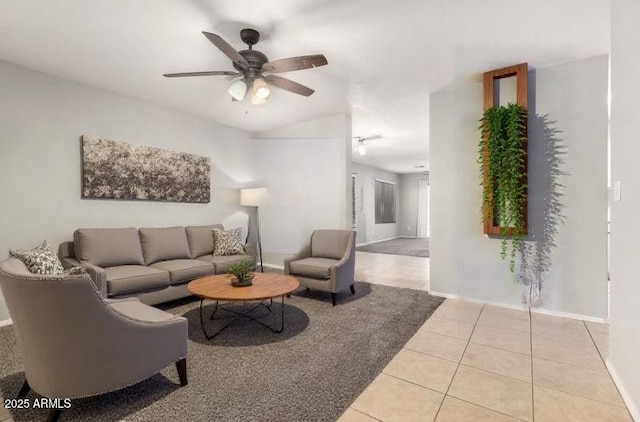 14919 W Hearn Cir, Surprise, AZ 85379 - living area featuring light tile patterned floors, ceiling fan, baseboards, and vaulted ceiling