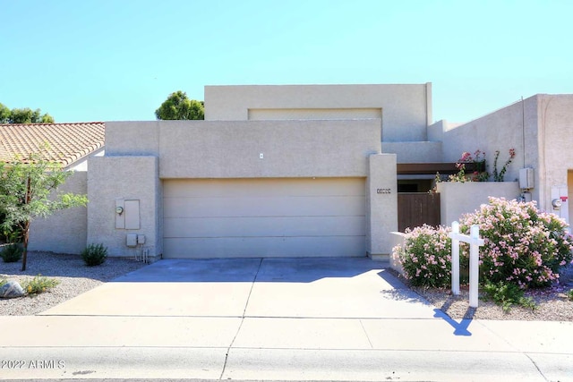 southwest-style home featuring a garage