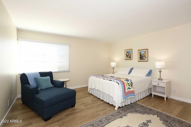 bedroom featuring hardwood / wood-style flooring