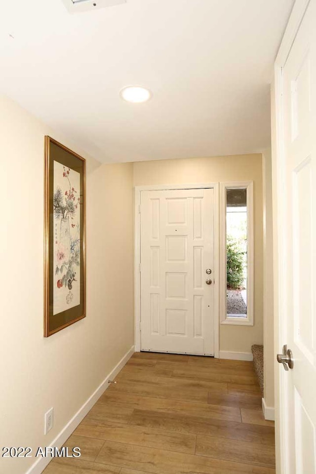 corridor featuring light hardwood / wood-style flooring