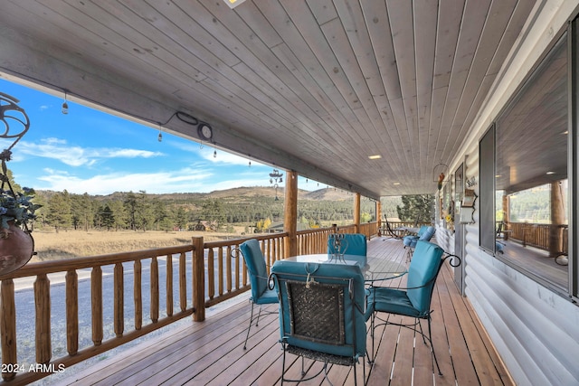 wooden deck featuring a mountain view