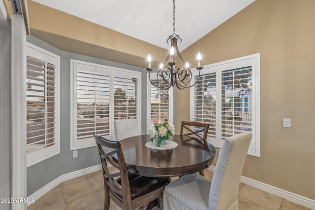 dining space featuring light tile patterned flooring, vaulted ceiling, and a notable chandelier