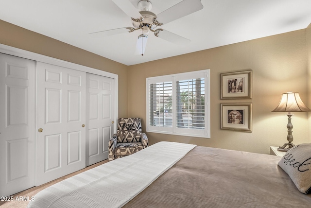 bedroom featuring a closet and ceiling fan