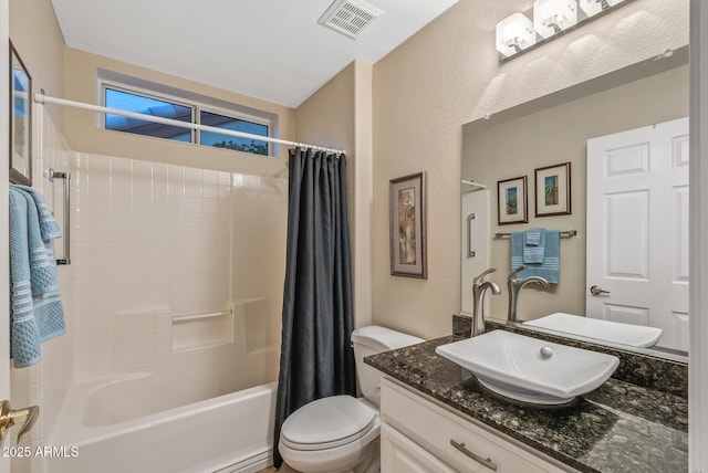 full bathroom featuring vanity, toilet, and shower / tub combo with curtain