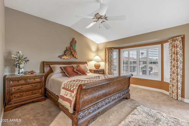 bedroom with lofted ceiling, light carpet, and ceiling fan