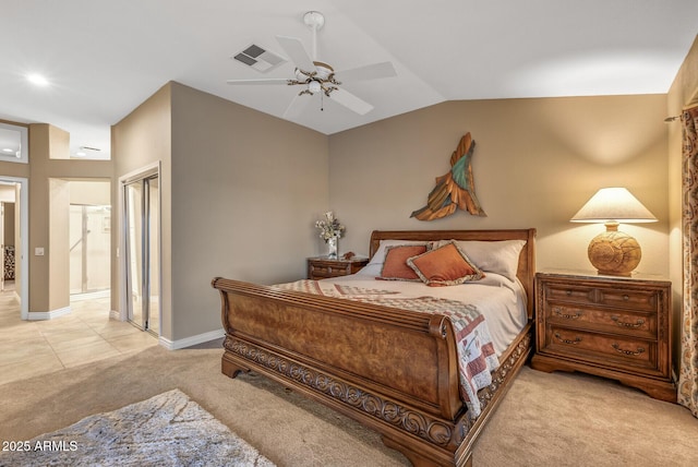 carpeted bedroom with lofted ceiling and ceiling fan