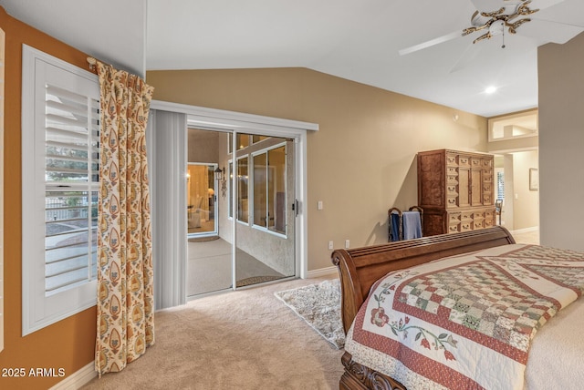 carpeted bedroom featuring access to exterior, vaulted ceiling, and ceiling fan