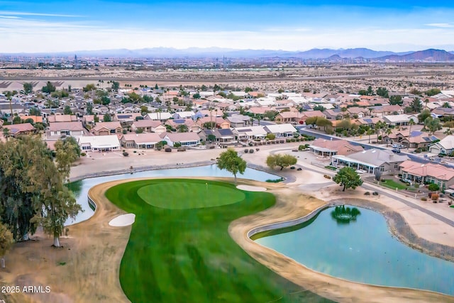 drone / aerial view featuring a water and mountain view