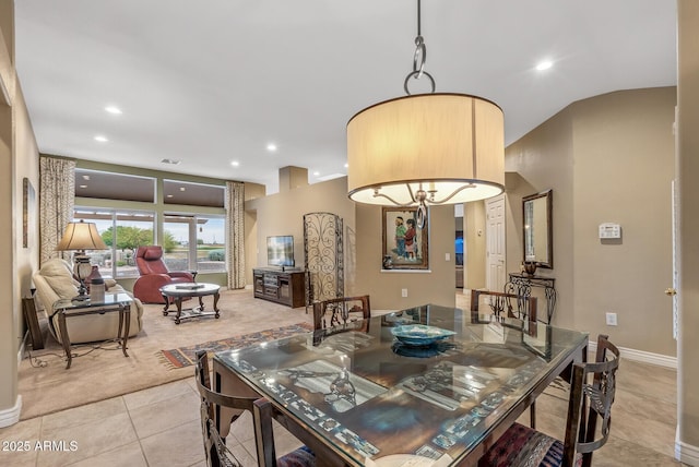 dining space featuring light tile patterned flooring