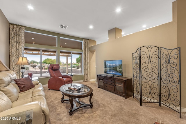 living room featuring light carpet