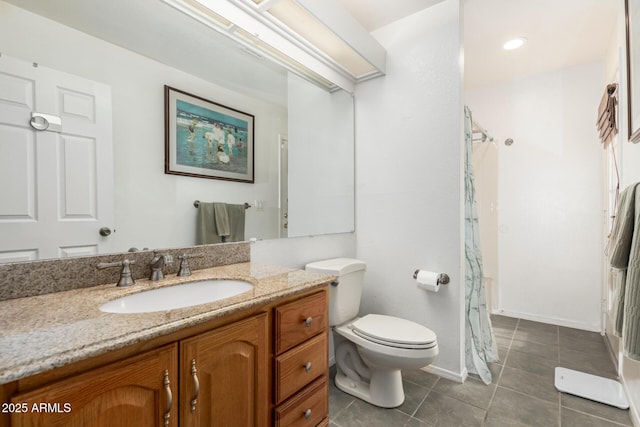 bathroom with toilet, tile patterned flooring, walk in shower, and vanity