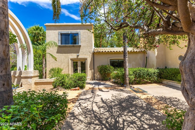 back of property featuring french doors