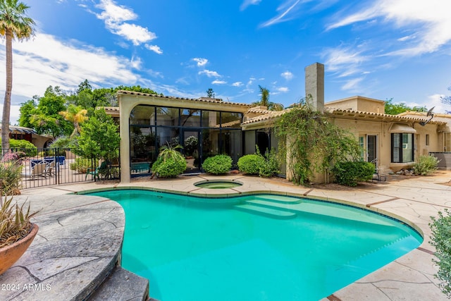 view of pool featuring an in ground hot tub and a patio