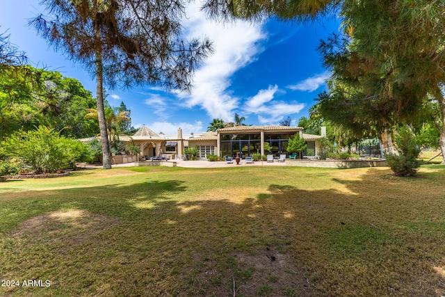 exterior space with a patio area and a yard