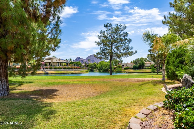 surrounding community featuring a yard and a water and mountain view