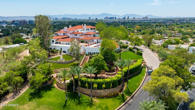 birds eye view of property with a mountain view