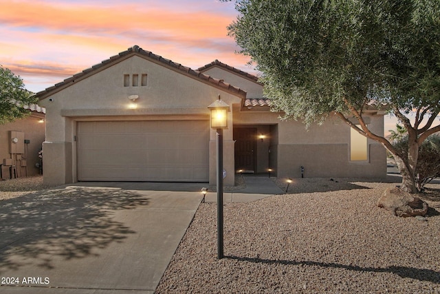 view of front of property featuring a garage