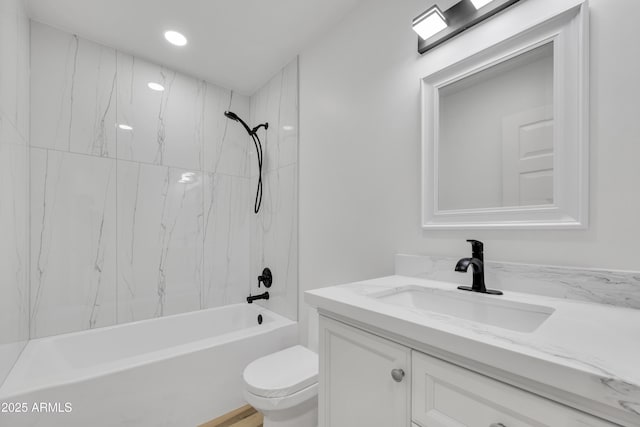 bathroom with toilet, vanity, and bathing tub / shower combination