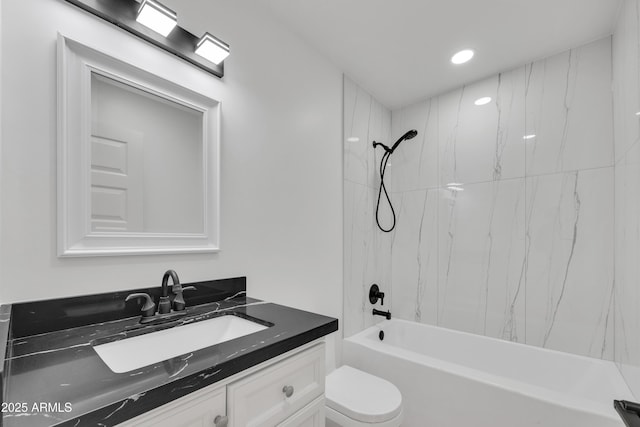 bathroom featuring vanity, toilet, and shower / bathtub combination