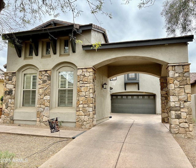 9285 E Canyon Vw, Scottsdale, AZ 85255 - view of front of house with an attached garage, stone siding, concrete driveway, and stucco siding