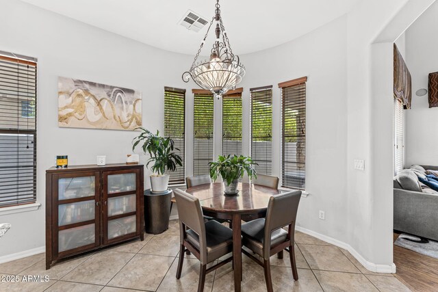 9285 E Canyon Vw, Scottsdale, AZ 85255 - dining area with baseboards, a notable chandelier, light tile patterned flooring, and visible vents