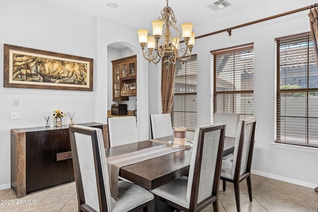 9285 E Canyon Vw, Scottsdale, AZ 85255 - dining room with baseboards, light tile patterned flooring, a chandelier, and visible vents