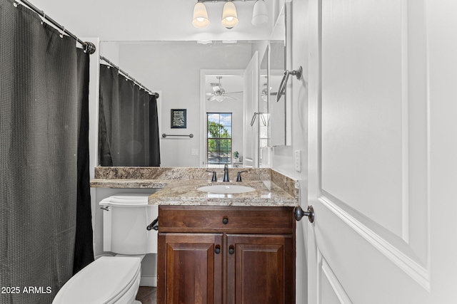 9285 E Canyon Vw, Scottsdale, AZ 85255 - bathroom with toilet, vanity, and ceiling fan