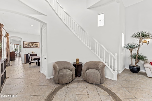 9285 E Canyon Vw, Scottsdale, AZ 85255 - foyer with stairs, light tile patterned floors, arched walkways, baseboards, and recessed lighting