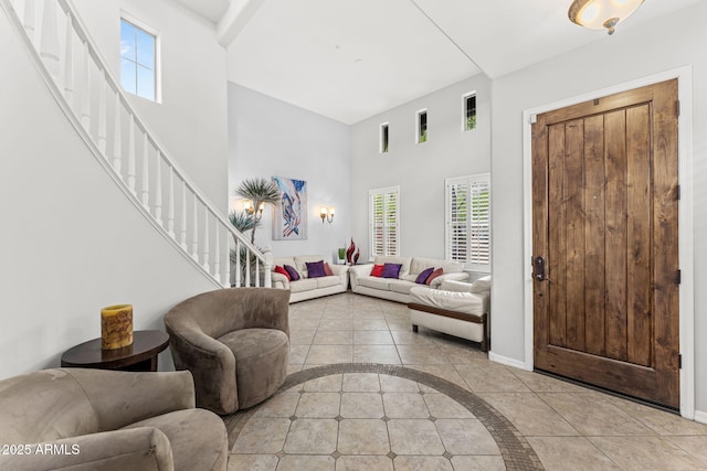 9285 E Canyon Vw, Scottsdale, AZ 85255 - living area with plenty of natural light, a high ceiling, stairs, and light tile patterned floors