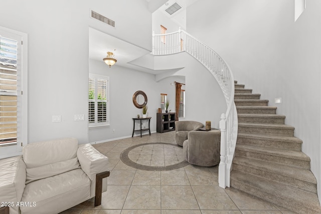 9285 E Canyon Vw, Scottsdale, AZ 85255 - interior space featuring tile patterned floors, baseboards, visible vents, and a high ceiling