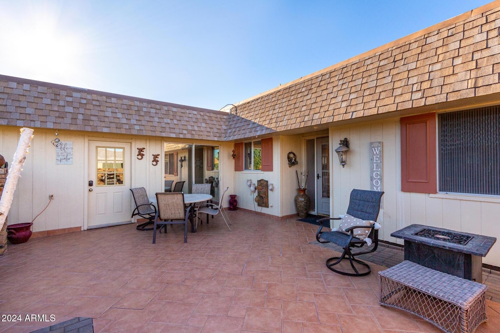 view of patio / terrace with a fire pit