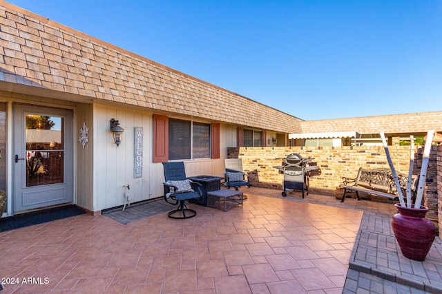 view of patio featuring a grill