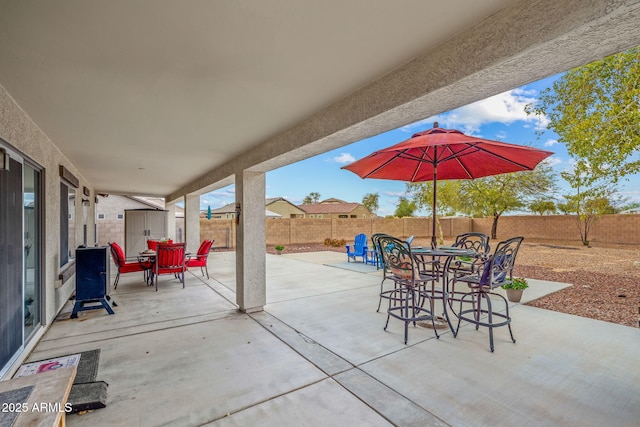 view of patio / terrace with outdoor dining space and a fenced backyard