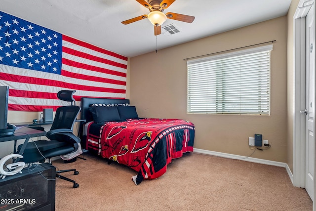 carpeted bedroom featuring a ceiling fan, baseboards, and visible vents