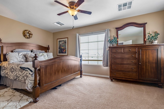 bedroom featuring ceiling fan, baseboards, visible vents, and light carpet