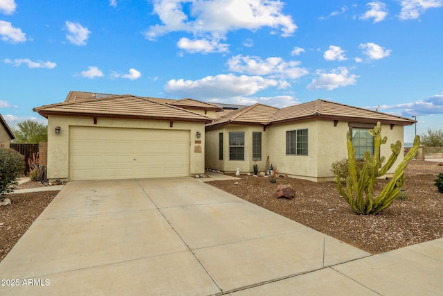 ranch-style home with stucco siding, a garage, driveway, and a tile roof