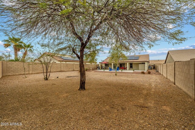 view of yard featuring a patio and a fenced backyard