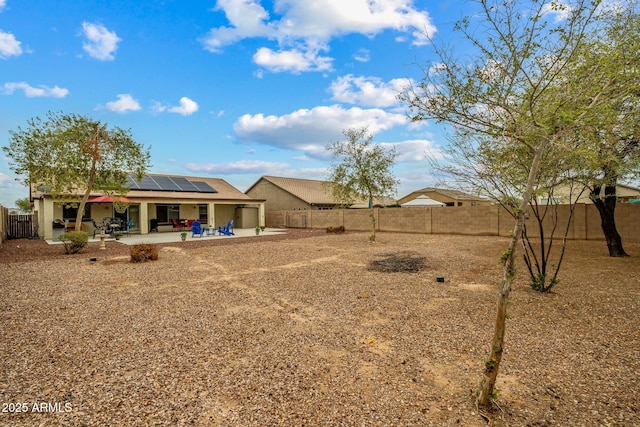 view of yard with a patio and a fenced backyard