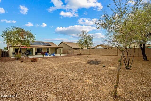 view of yard with a patio and a fenced backyard