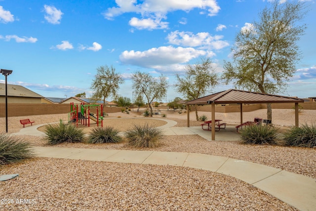 view of yard with a gazebo, fence, playground community, and a patio area