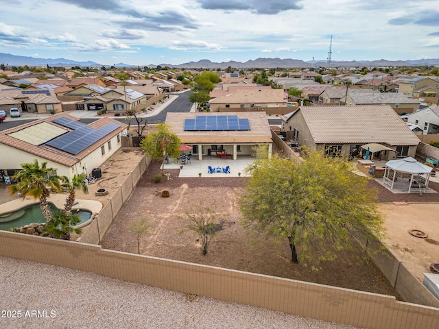 birds eye view of property with a mountain view and a residential view