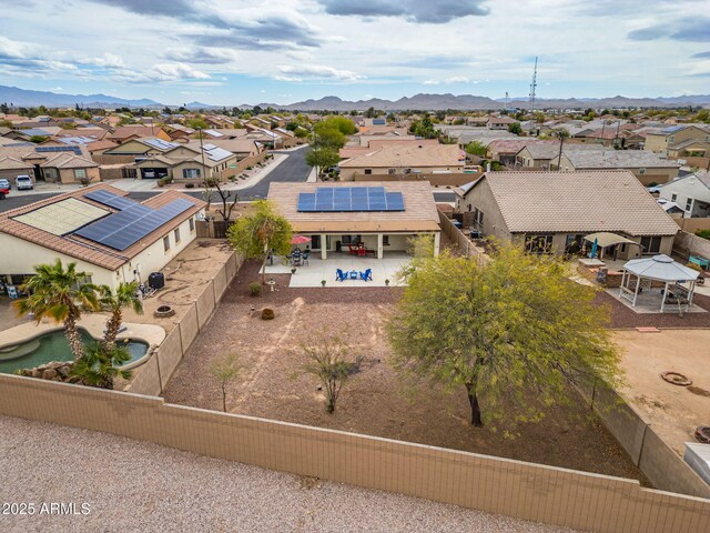 birds eye view of property with a mountain view and a residential view