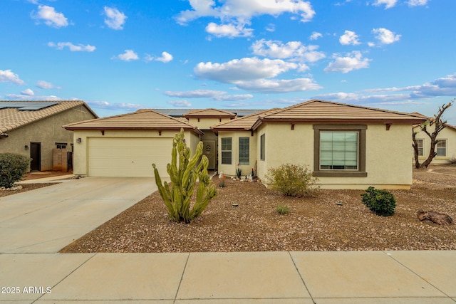 ranch-style home with stucco siding, a tiled roof, concrete driveway, and an attached garage