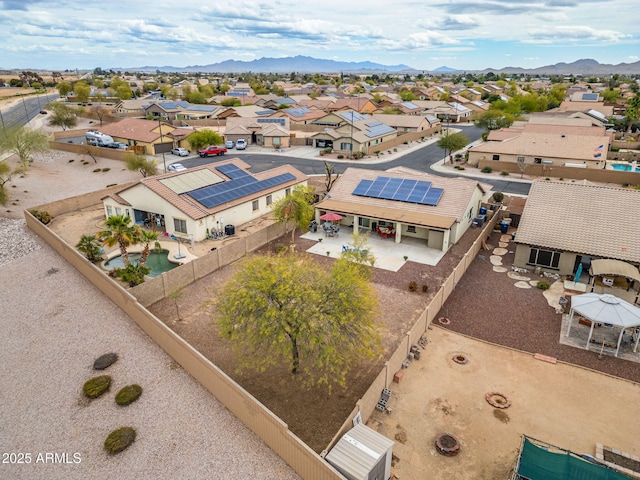 birds eye view of property featuring a mountain view and a residential view