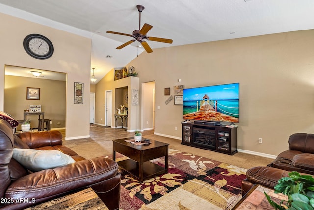 living room with baseboards, carpet, ceiling fan, a fireplace, and high vaulted ceiling