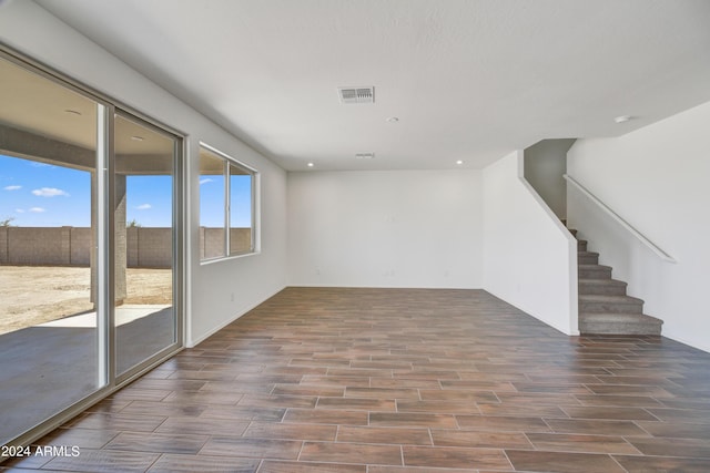 interior space featuring recessed lighting, visible vents, stairway, and wood finished floors