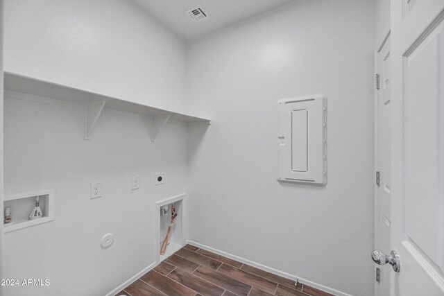 laundry area with washer hookup, hookup for an electric dryer, gas dryer hookup, dark wood-style flooring, and laundry area
