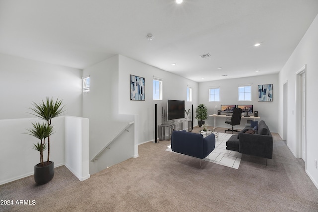 living room featuring visible vents, recessed lighting, light colored carpet, and baseboards